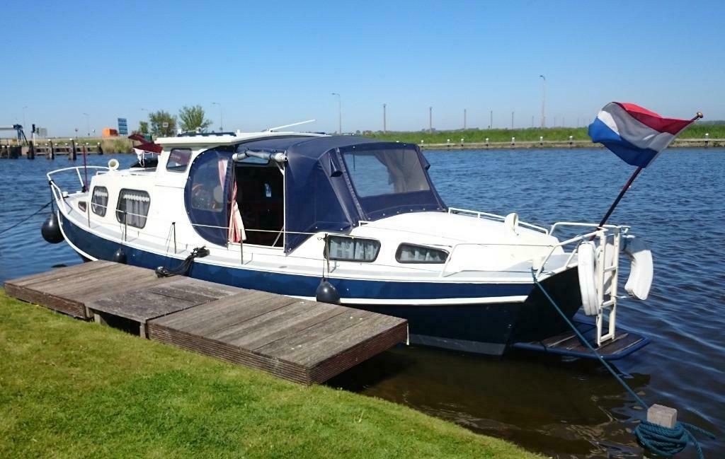Schouw stalen kajuitboot met perkins motor + trailer | Botenscout Online